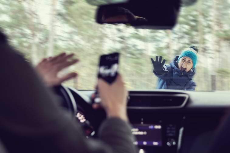 Man using a cellphone while driving about to hit a child crossing the street causing Pedestrian accident